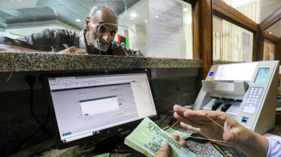 Cash crunch pushes Libyans to bank cards despite hurdles