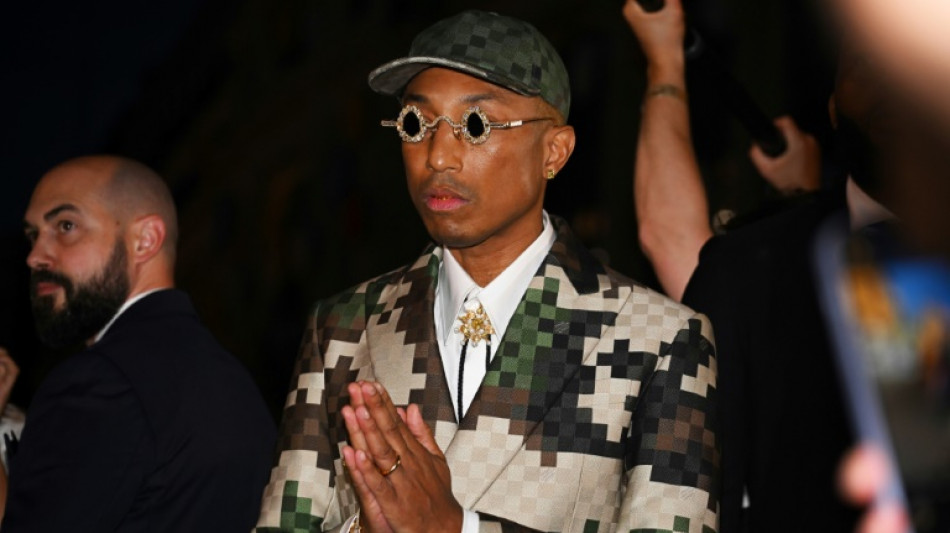 Pharrell brings gospel party to Paris with fashion debut