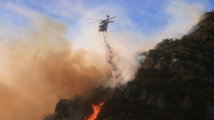 Malibu wildfire grows as thousands still evacuated