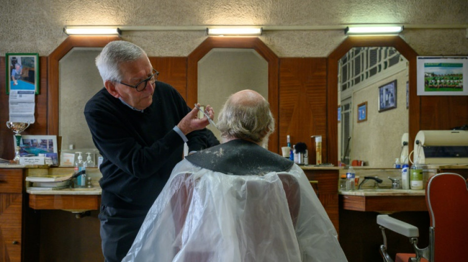 French barber still trimming at 90