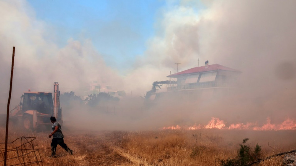 Greek firefighters in uphill battle to save famed natural park